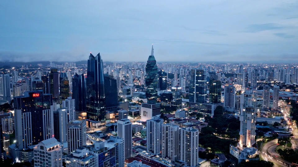 A city skyline and business district at dusk